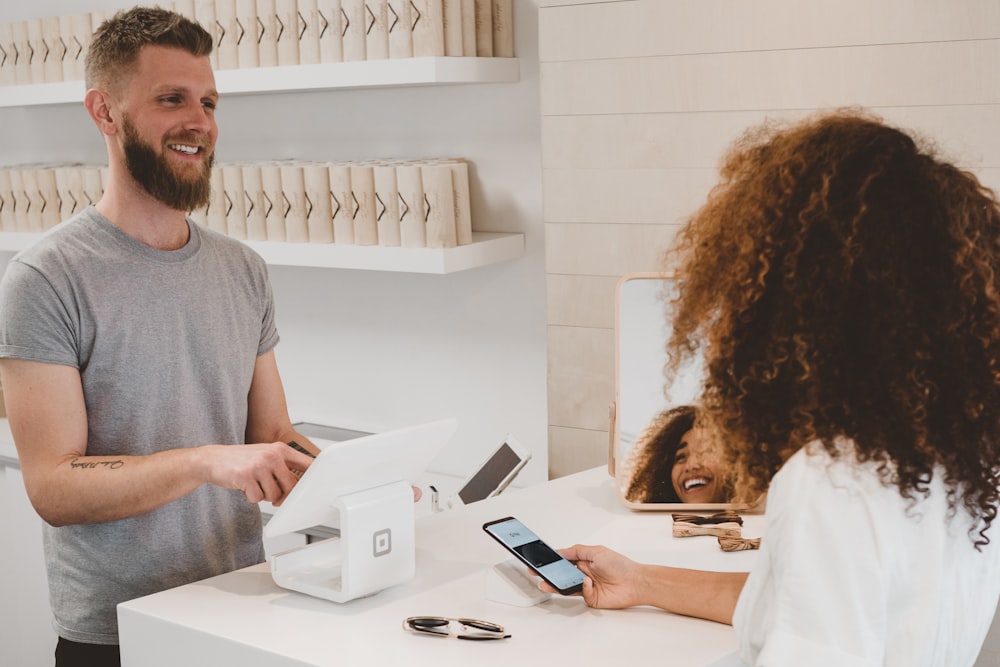 A customer completing a purchase at Delta Tech